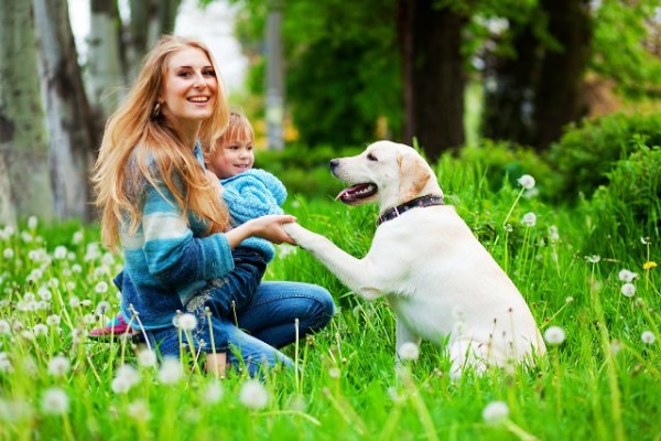 Woman with girl and dog