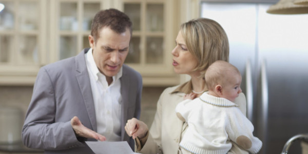 husband and wife with baby arguing